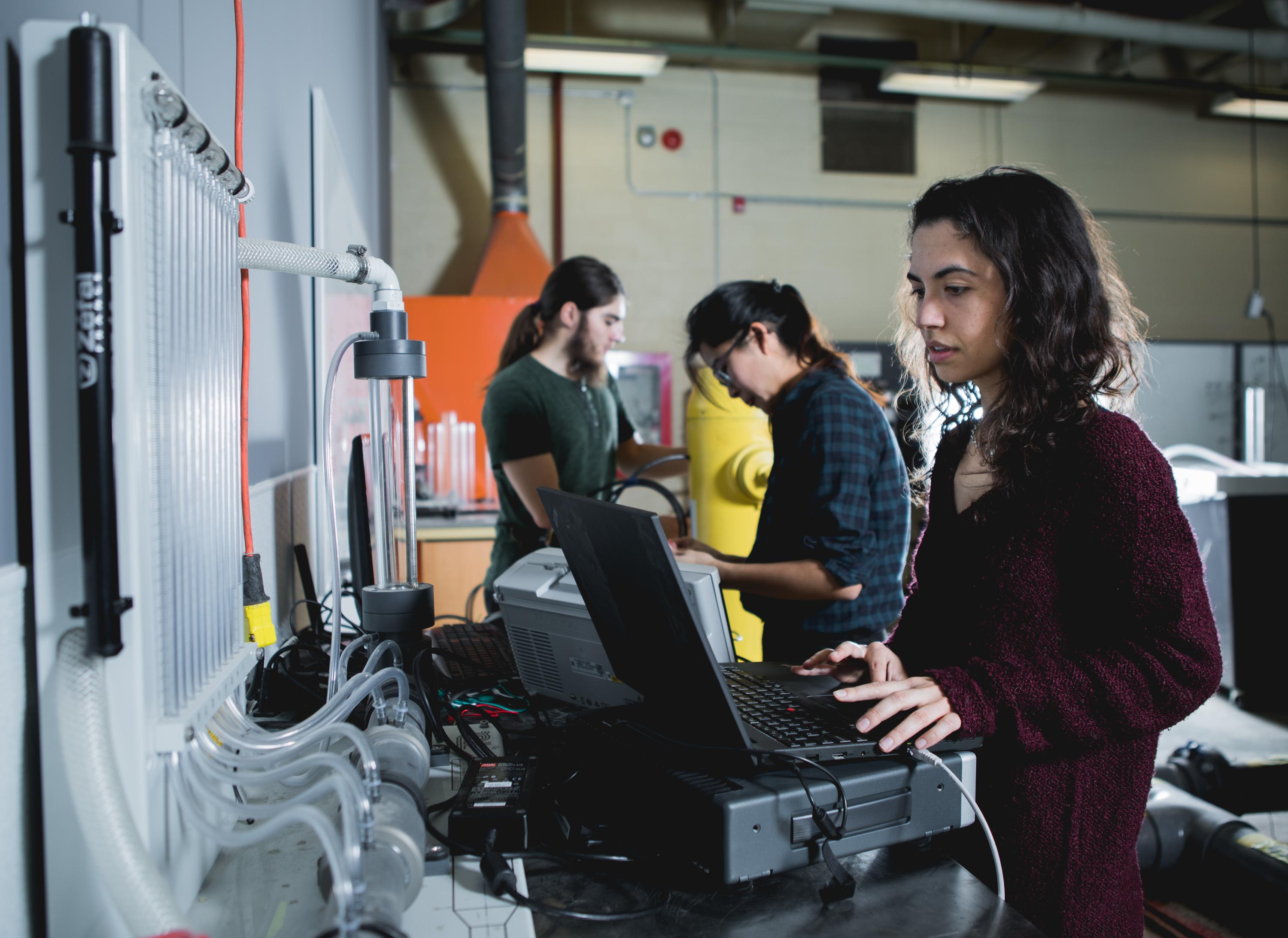 Roya Cody at work in the Structural Dynamics Identification and Control Laboratory at Waterloo Engineering.