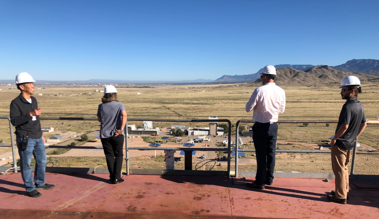 People looking out at Sandia National Laboratory solar test facility