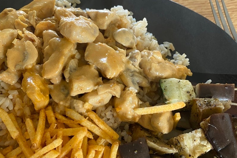 meal of rice chicken and fries
