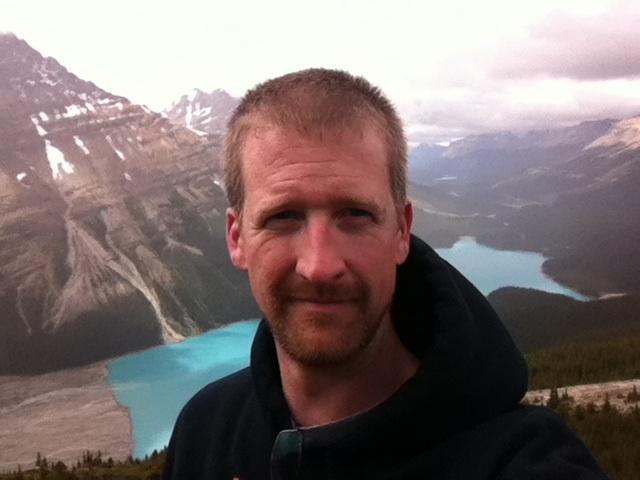 Philip DeWitt profile picture with mountainous background