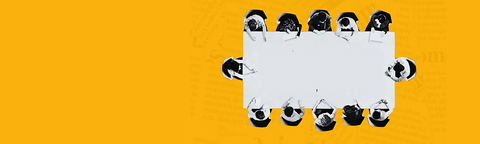a group sitting around a board room table- seen from above