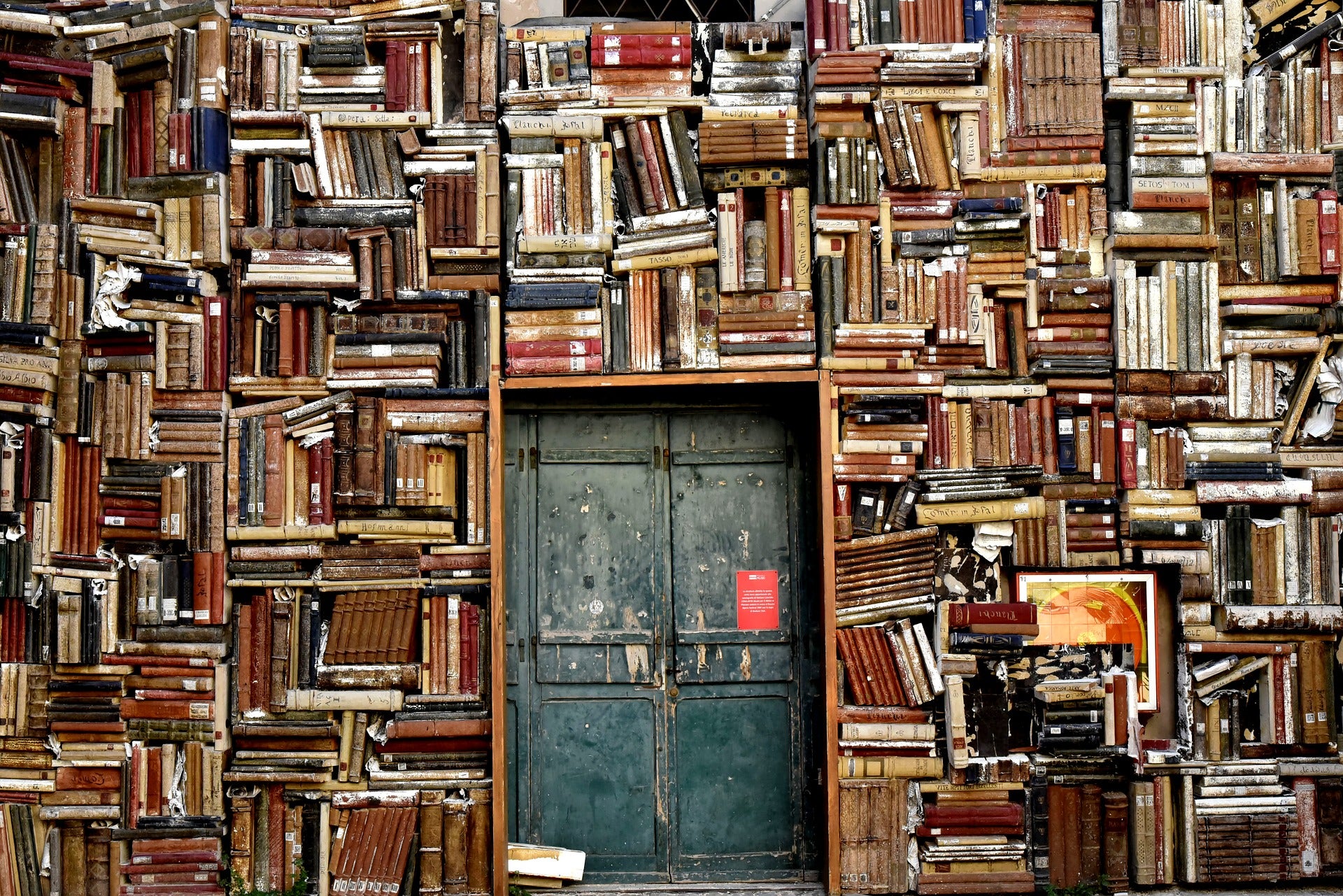 books stacked around doorway