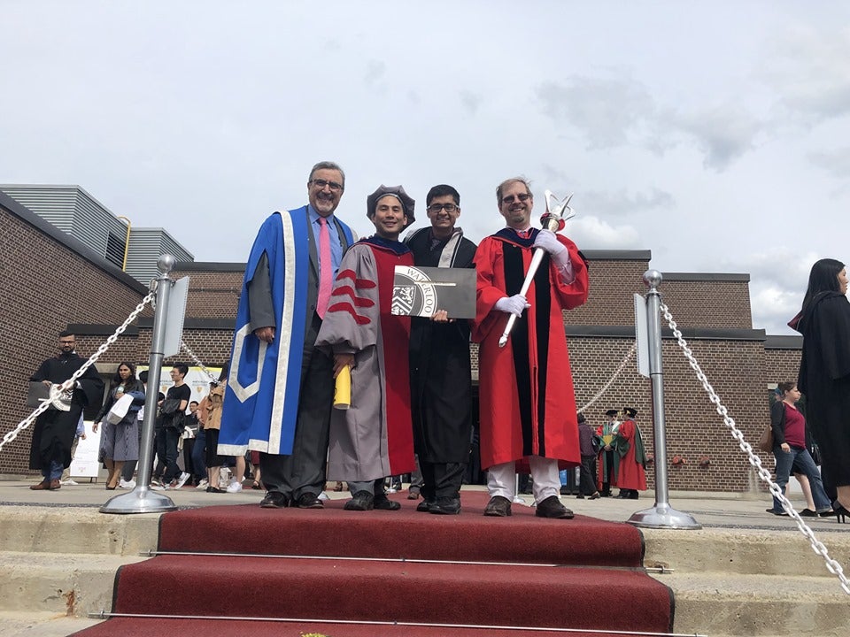 Convocation 2019 photo of SE Class Rep Bilal Akhtar, SE Director Patrick Lam, CS Director Undergraduate Dan Brown, and UW President Feridun Hamdullahpur