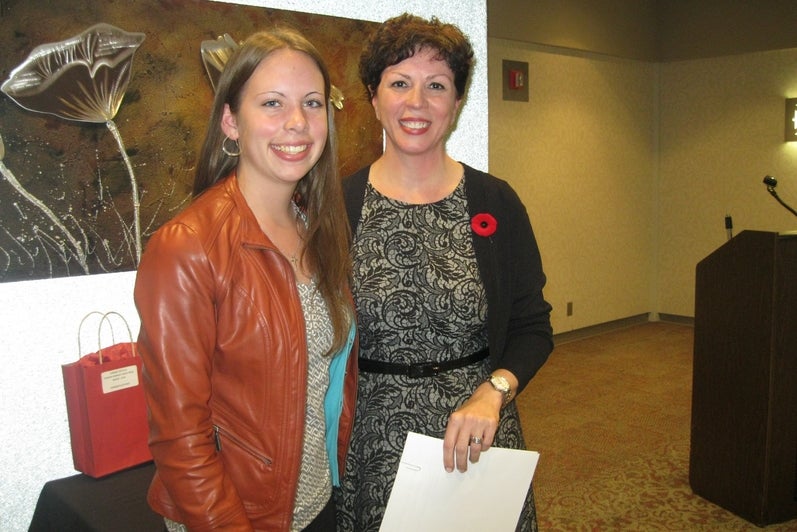 Photo of Rachel Bennett presented with the Spanish Embassy Book Prize - Intermediate Level by Dr. Monical Leoni