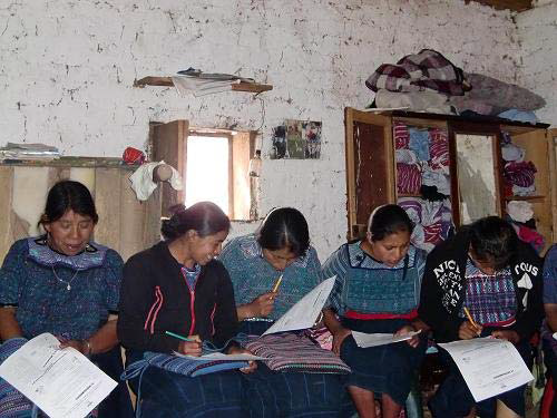Guatemalan women reading books in class