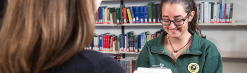 two people sitting across from one another in the Library 