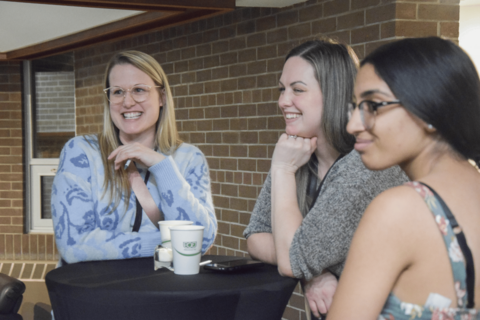 Three students laughing at the Take a Leap Speed Networking event