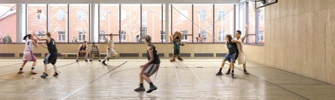 Students playing basketball in the Gymnasium