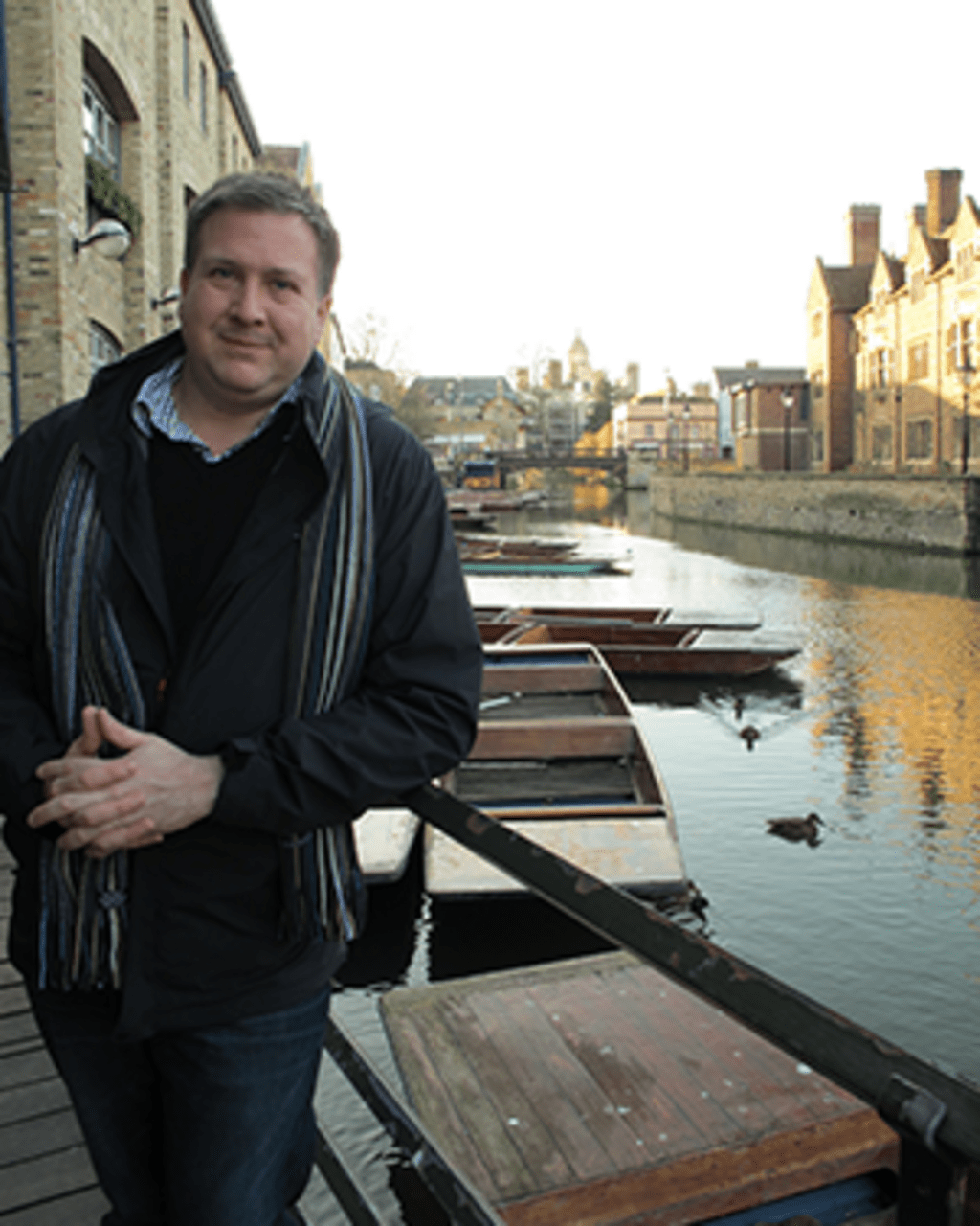 Ryan Touhey stands in front a a canal in Venice
