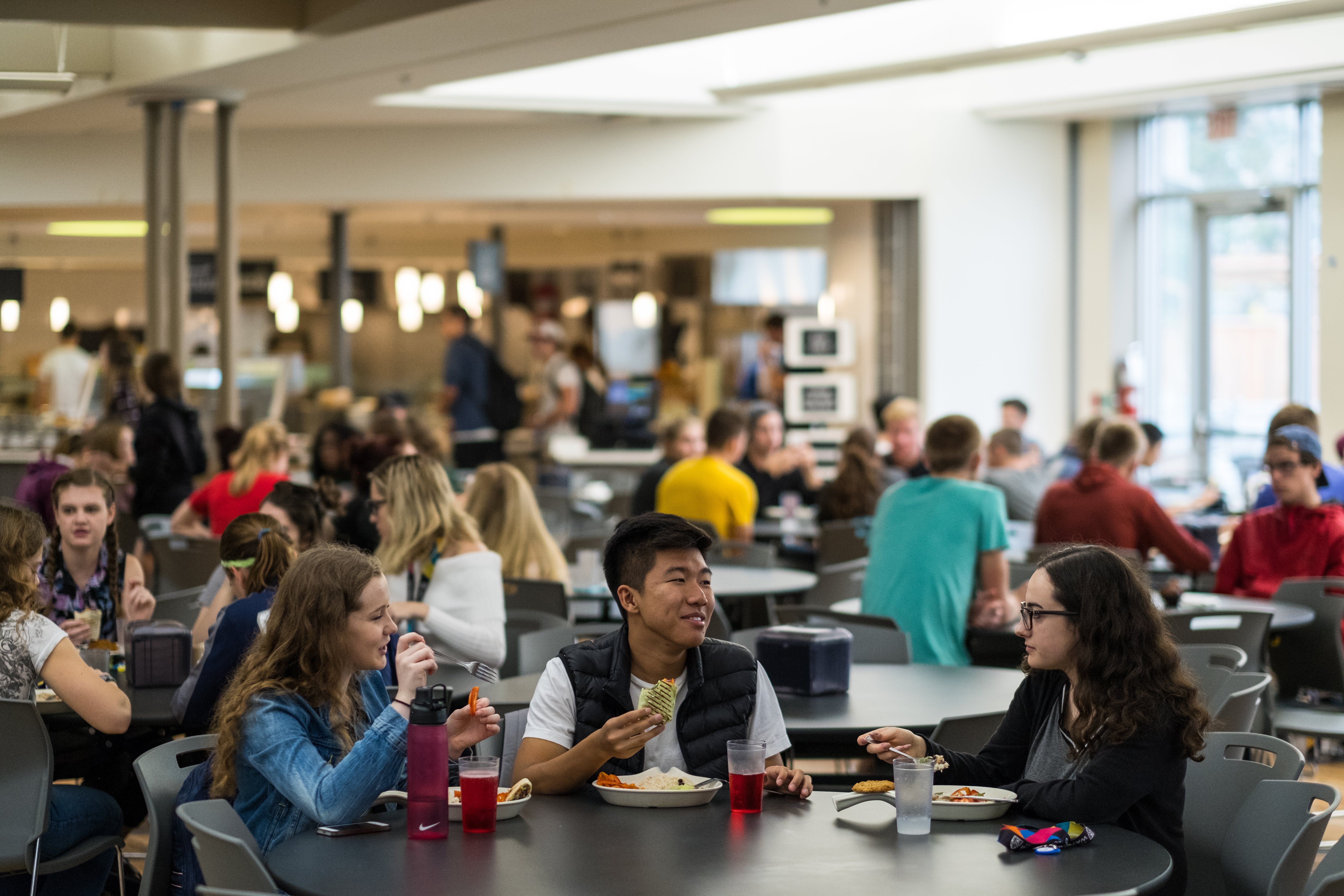 People eating lunch in cafeteria