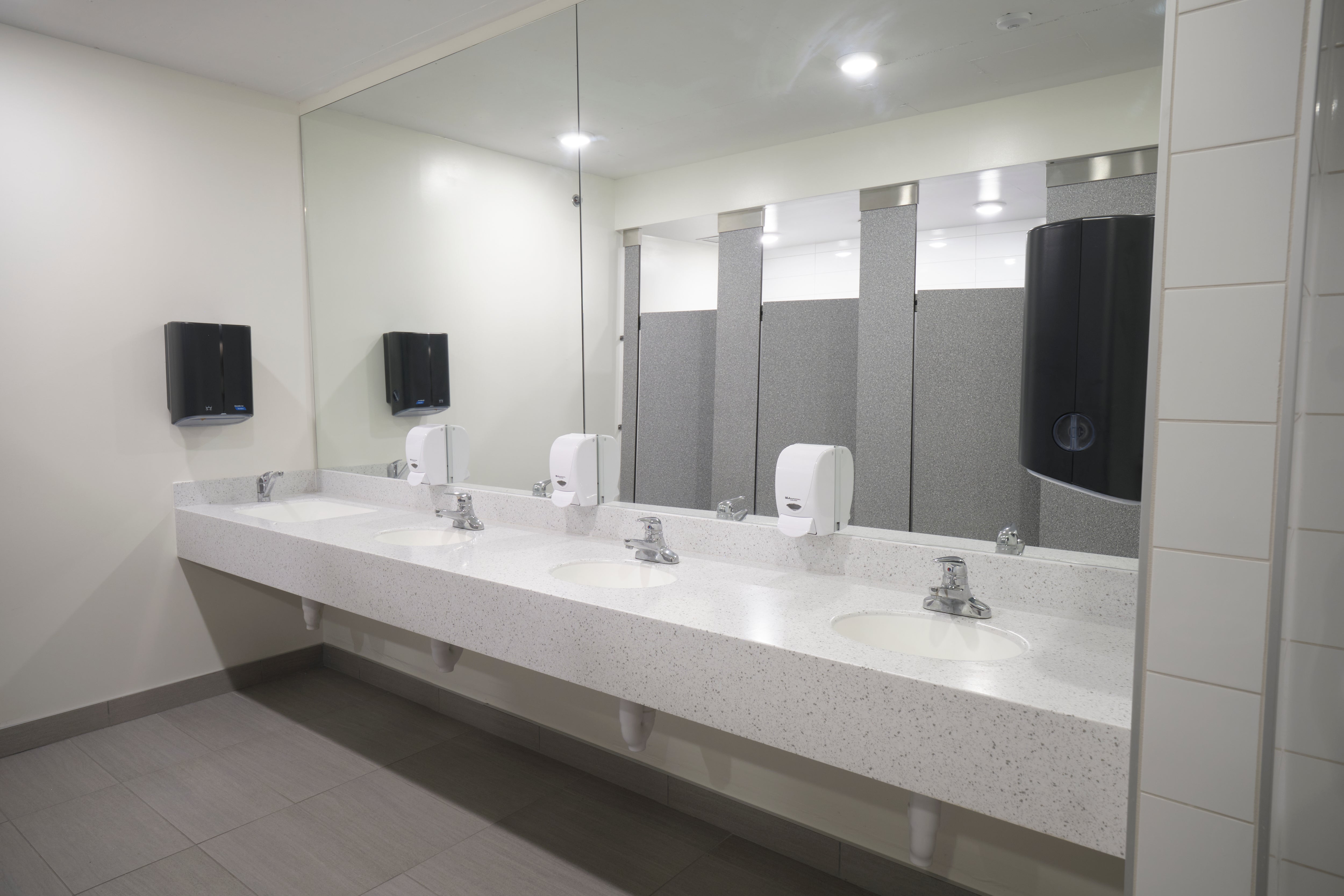 Row of sinks in washroom