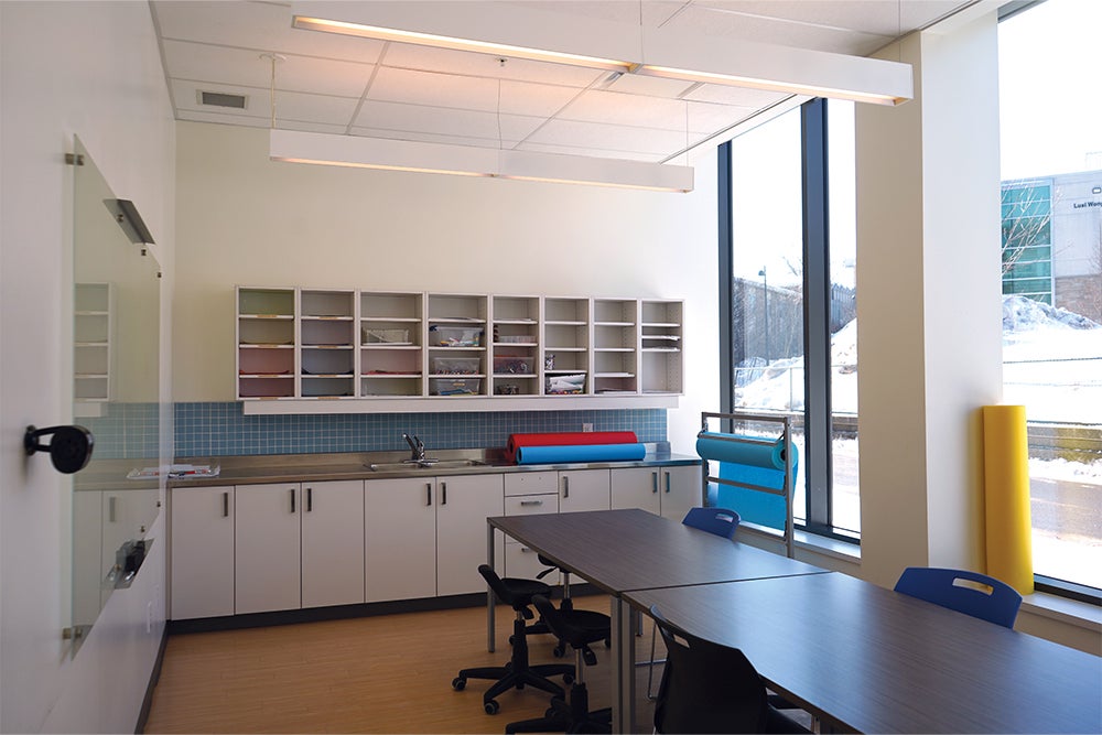 The Buttery space with chairs, table, counters and cupboards