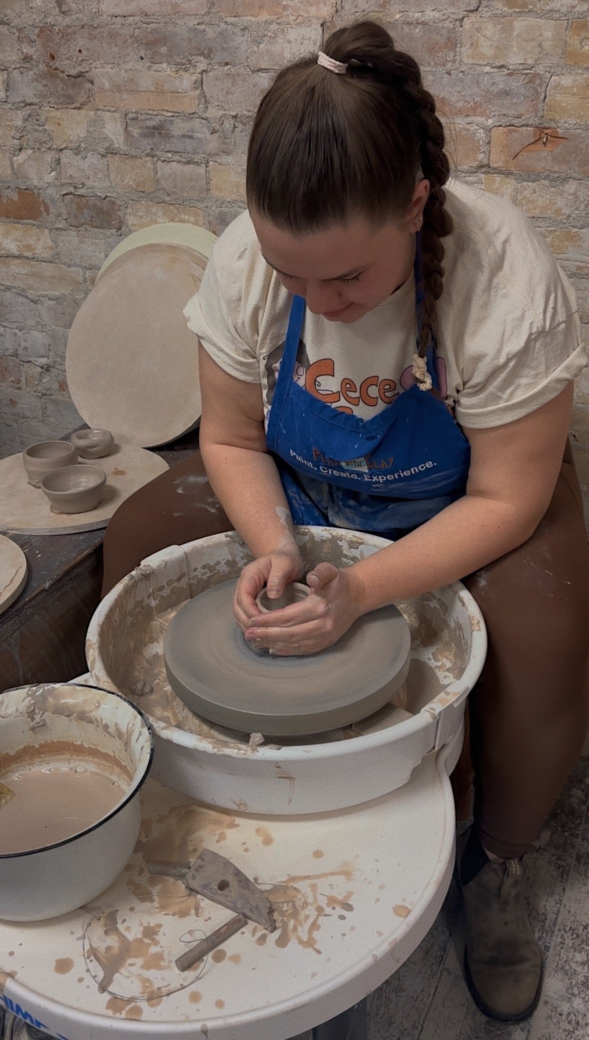 Sophia in pottery class