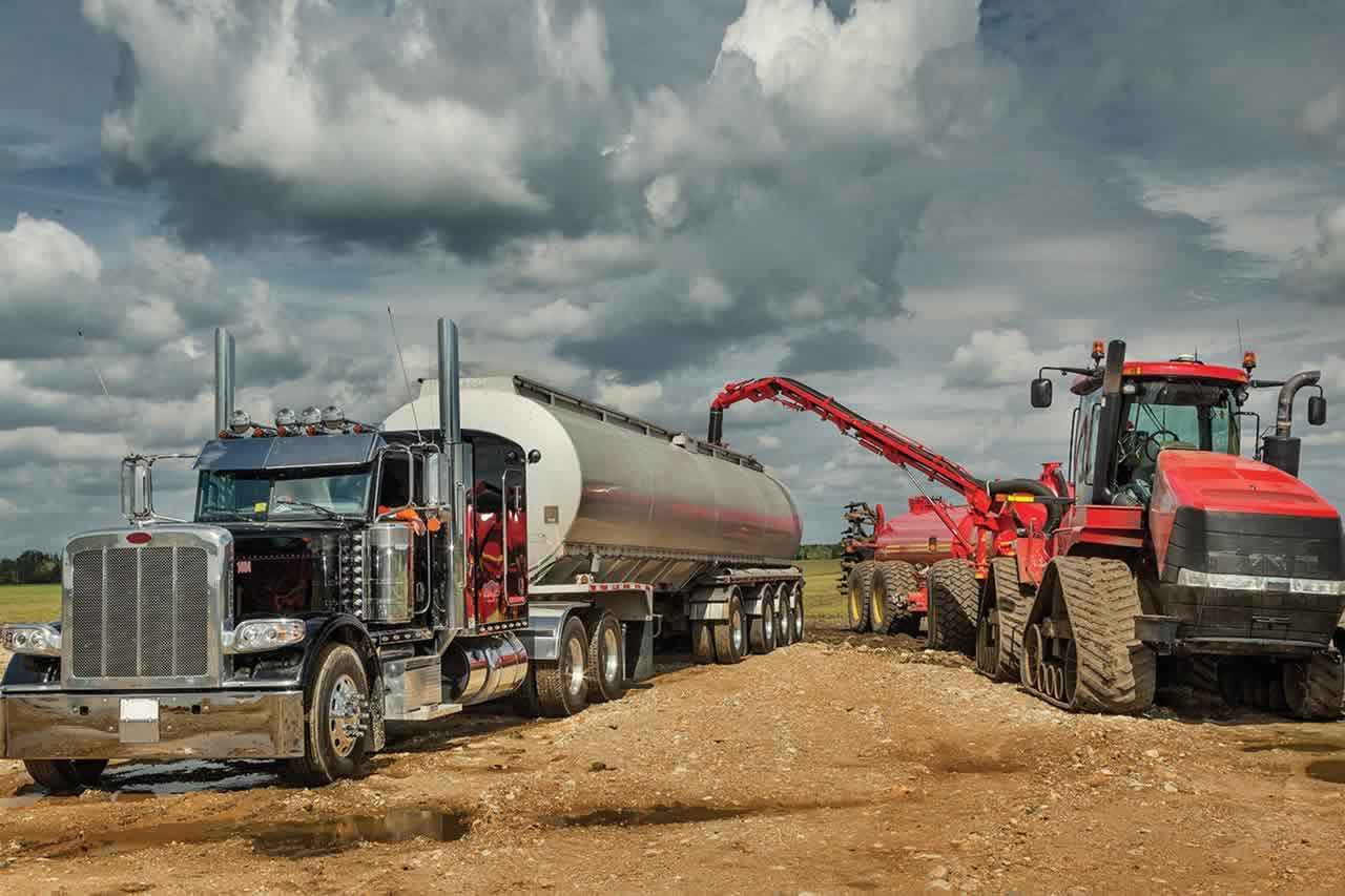 trucks unloading fertilizer