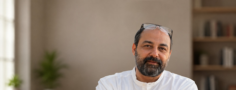 Ali Ghodsi in a room with books