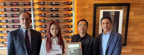Ting Cheng, Kenneth Zhou, and the Eckler presenters with posing with the award.