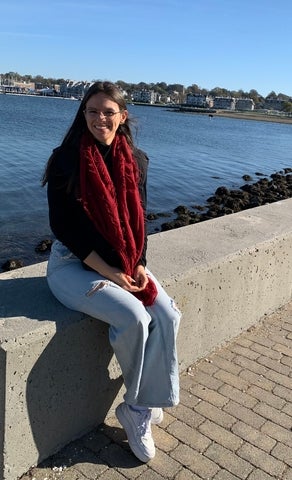 Xamy sitting in front of a river