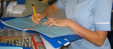 Nurse writing up her notes