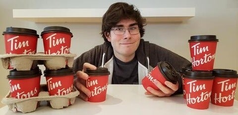 Michael Wallace with Tim Hortons' cups