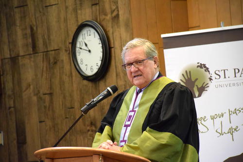 Lloyd Axworthy wearing Chancellor robe speaks at INDEV ring ceremony