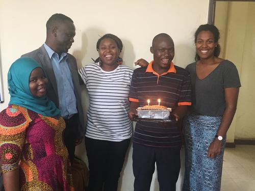 Indra and four co-workers celebrate a birthday with a cake