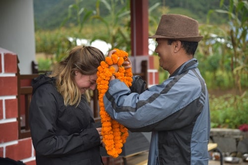 Courtney receives lei as part of welcoming ceremony