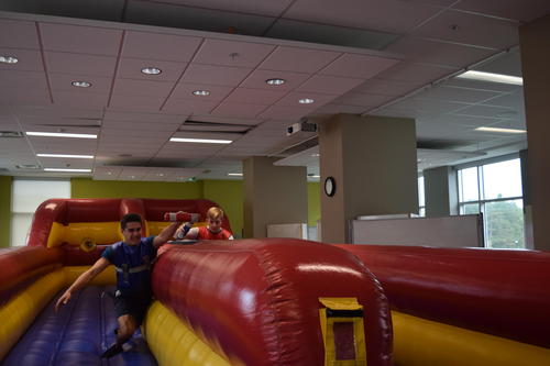 students compete on a giant inflatable 