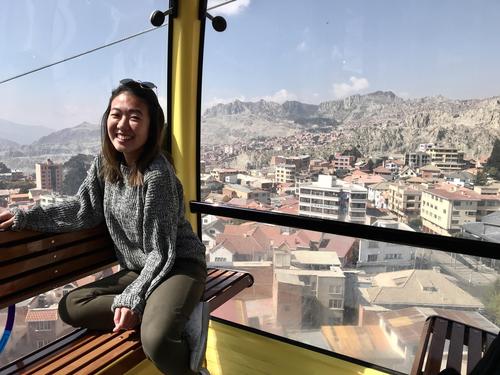 Cherie Wai rides a cable car to work in La Paz