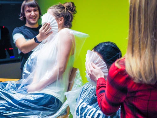 Elizabeth and Katherine are pied by students