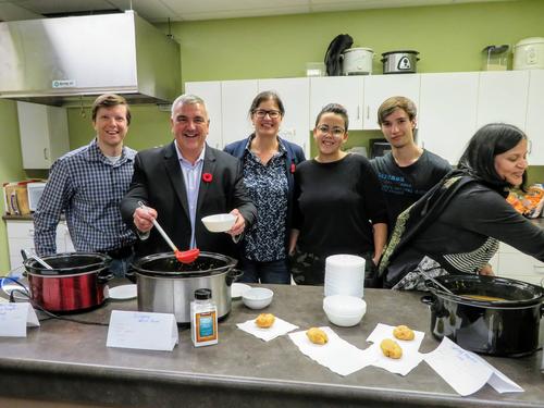 Waterloo Councillor Jeff Henry, Mayor Dave Jaworsky join Lori Campbell and volunteers in the kitchen for soup lunch