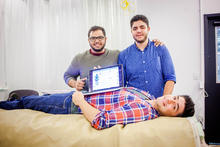 Three Curiato co-founders display their product