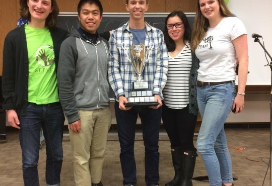 Five St. Paul's residents pose with the trophy after winning College Cup
