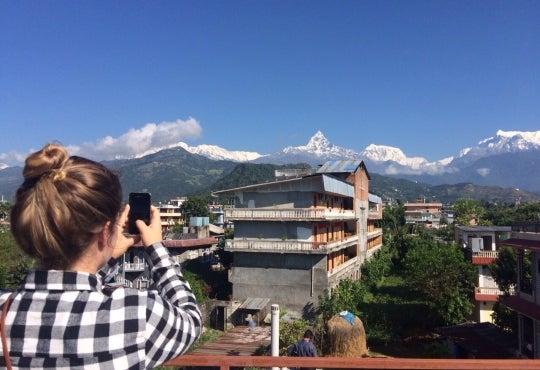 Courtney Lang takes a picture of the Annapurna Mountains