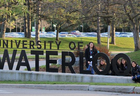 Attendees of Directions Indigenous youth camp pose with University of Waterloo sign