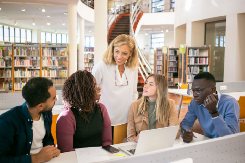 Group of diverse people in a library