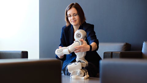 Dana Kulic with a small robot