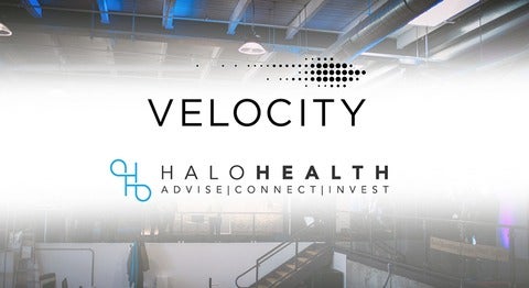 Photo of indoor space with text, 'Velocity' and 'Halo Health'