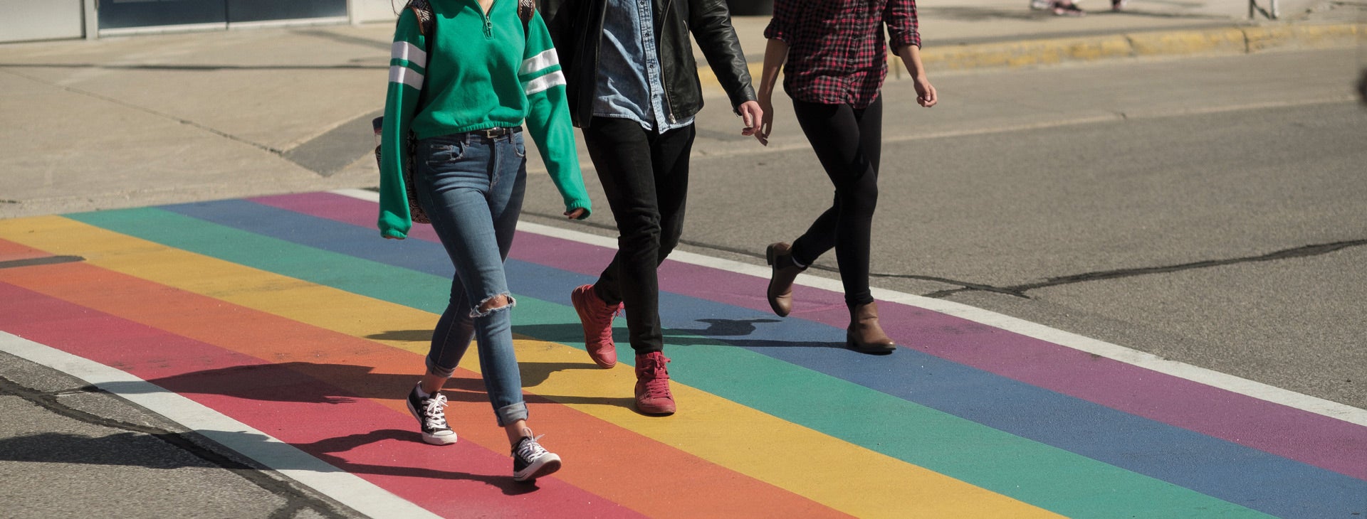 students walking across a rainbow crosswalk  all - <alt tags> will be updated on pilots