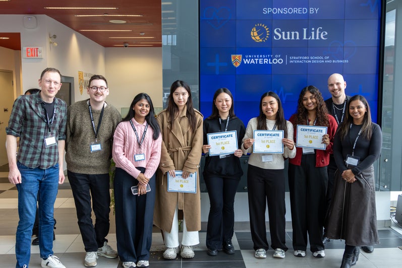 Students and Judgaes standing with awards