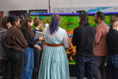 People look at LED wall installation for Lights On