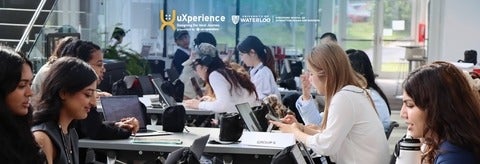 Students working in groups at tables