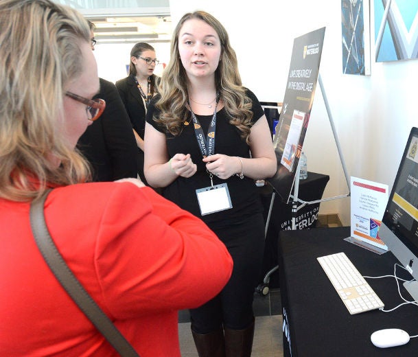 Laura Wells, a second-year student in the GBDA program, describes her team's project at the end-of-year showcase 