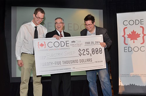 Electric Sheep (Carlos Saavedra and Jason Ernst), winners of CODE, with Tony Clement