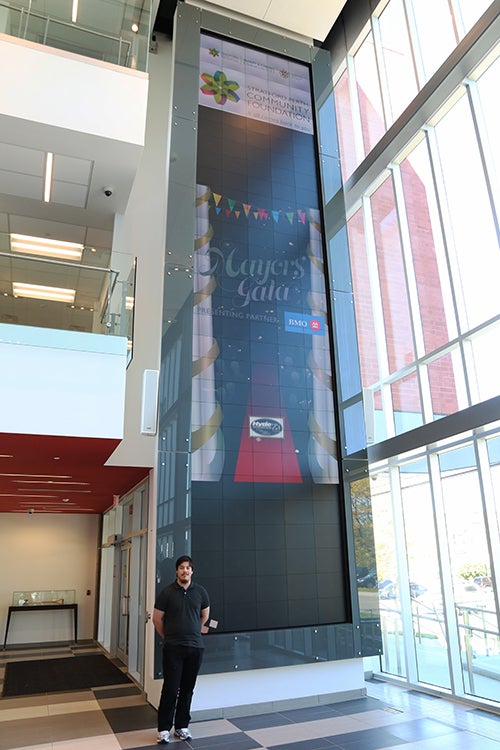 GBDA student Ethan Pelletier with his winning design for the Mayor's Gala