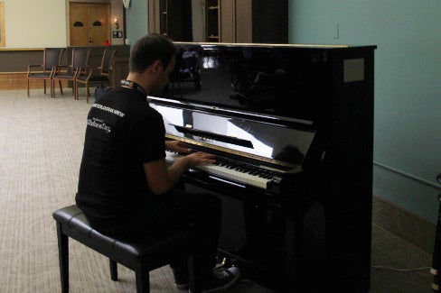 Student playing piano