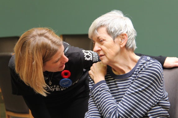 Two women speaking together