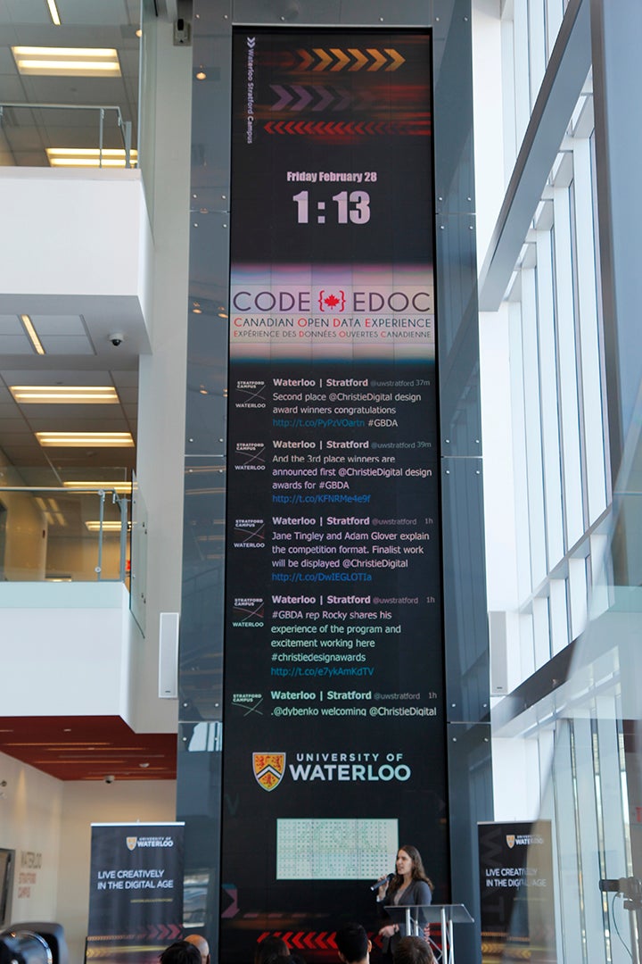 Keynote speaker Hilary Mason in front of the Christie Digital MicroTile Wall.