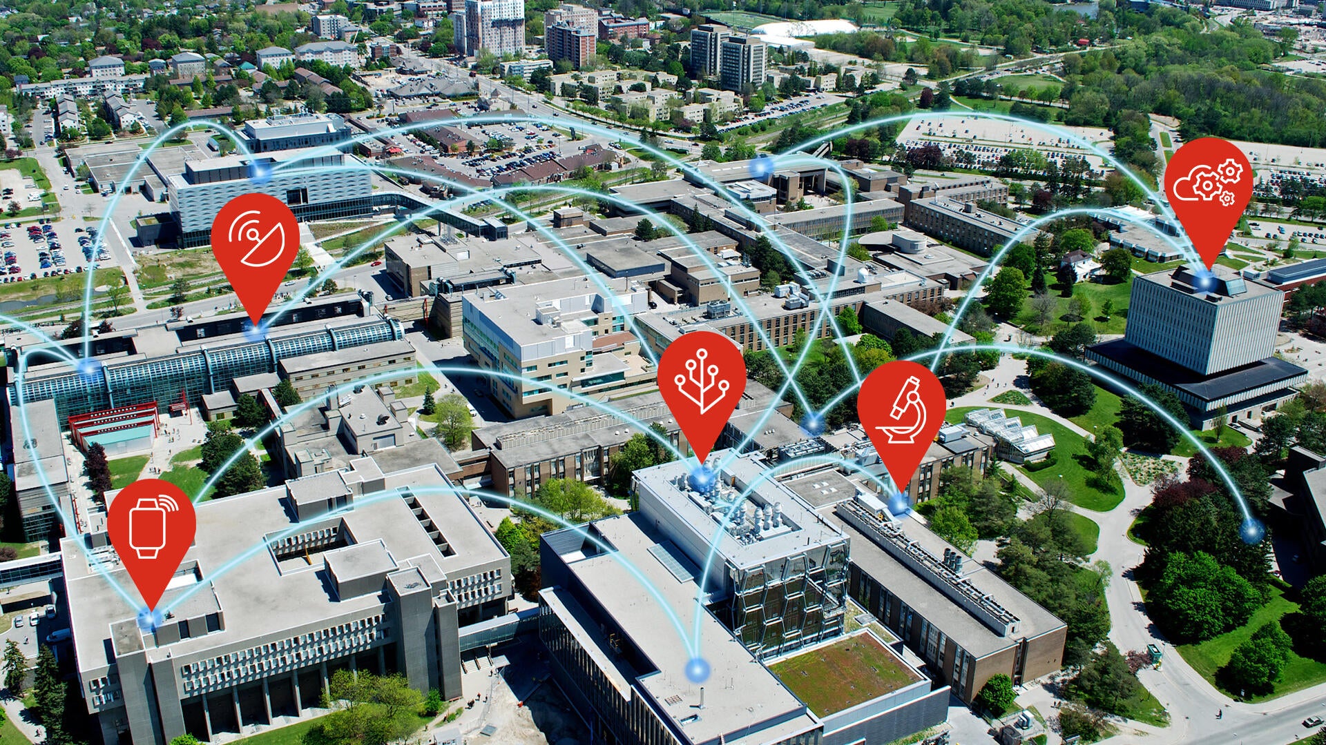 Waterloo Aerial Campus photo with blue lines connecting buildings and smart device icons