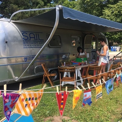 Airstream trailer with a display of flags