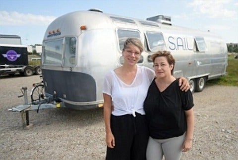 Tara Cooper and Denise St. Marie in front of the airstream